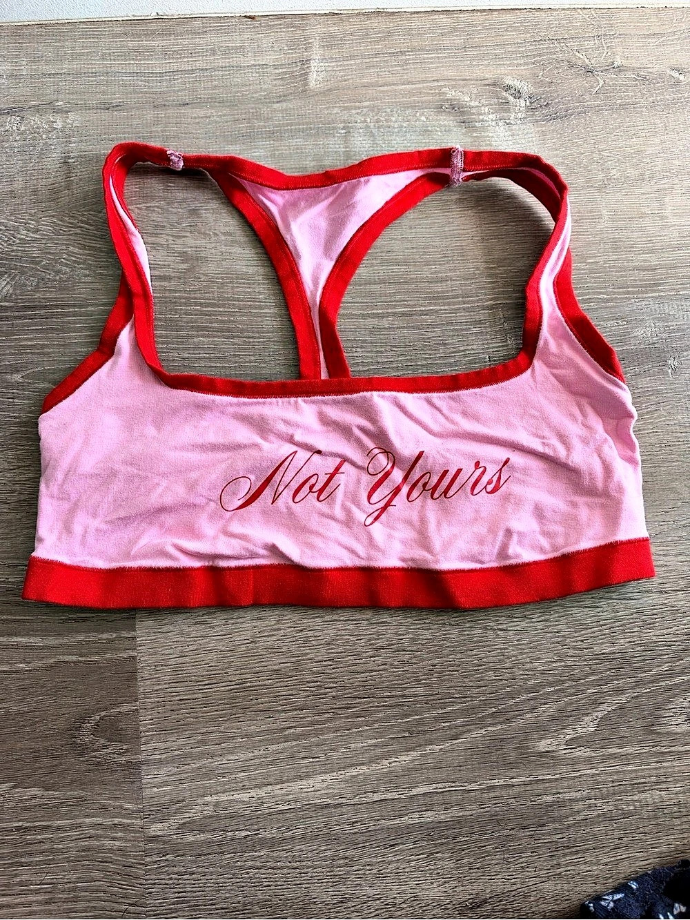 Victoria’s Secret PINK “Not Yours” sports bra in a cute pink and red colorblock